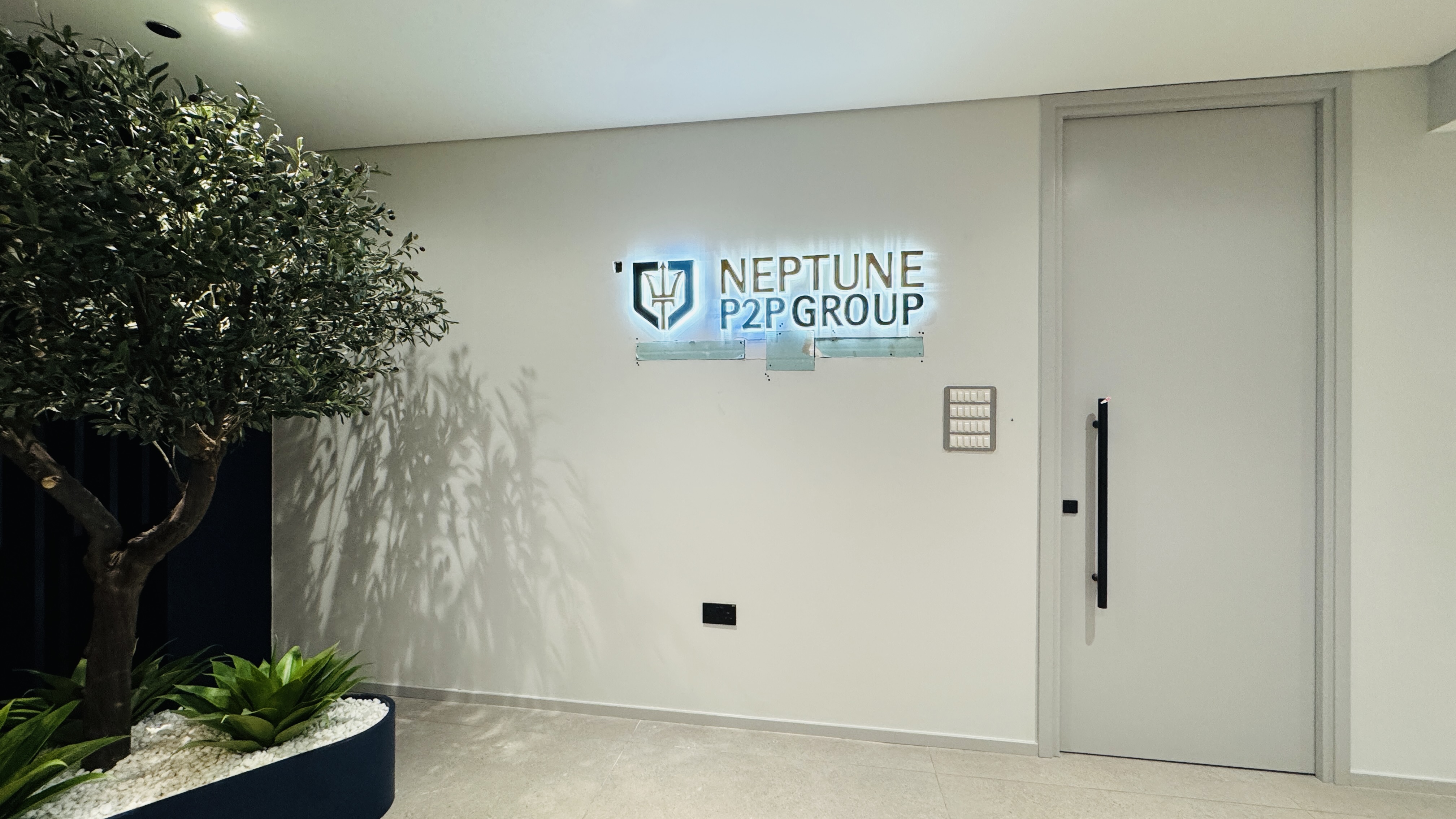 Neptune P2P Group illuminated interior wall sign